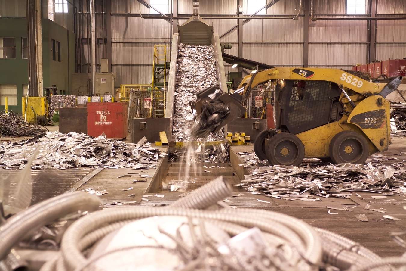 Bobcat handling scrap metal for recycling