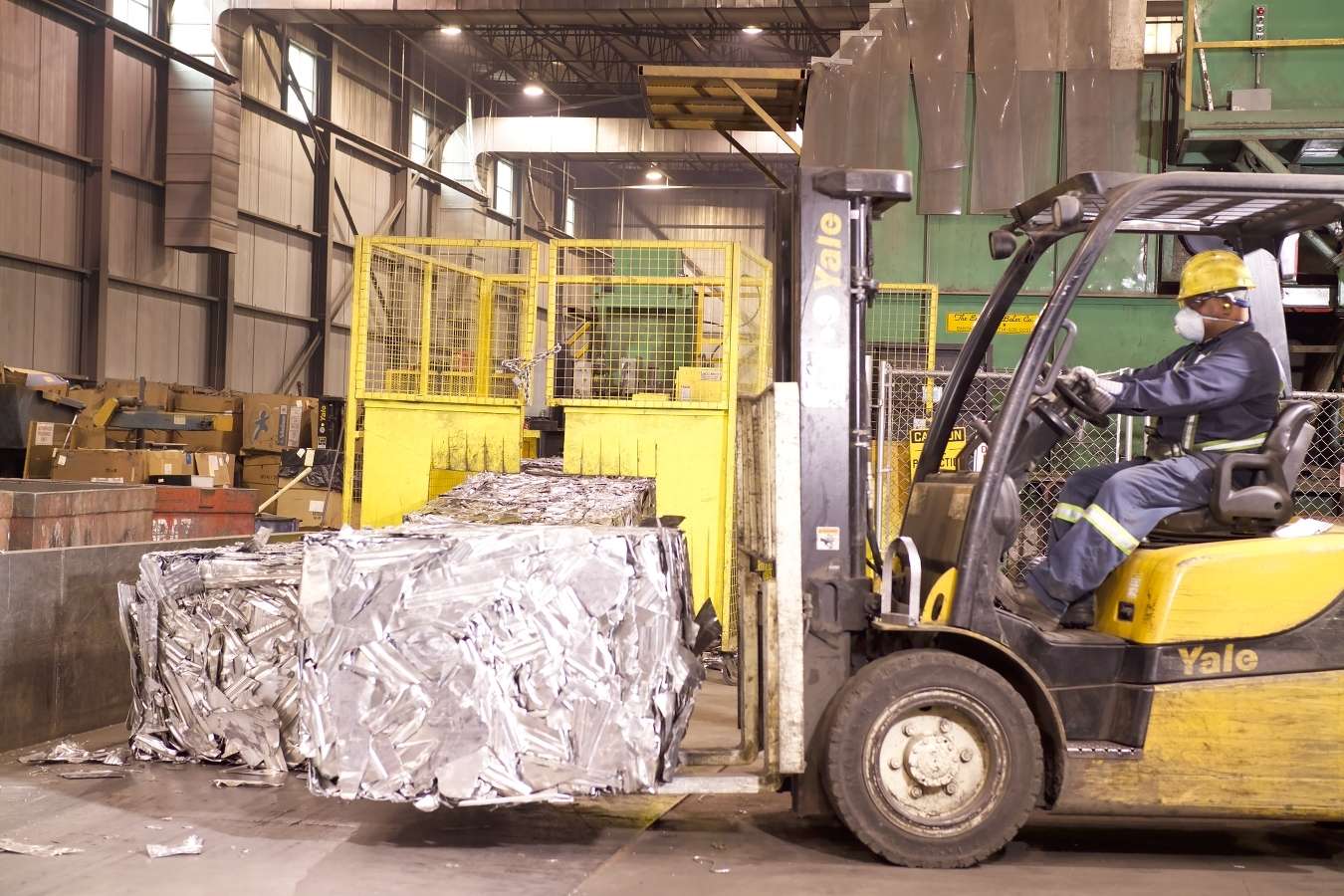 Forklift transporting scrap metal for recycling